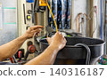 Automotive mechanics working in a car repair shop: Vehicle inspection and maintenance 140316187