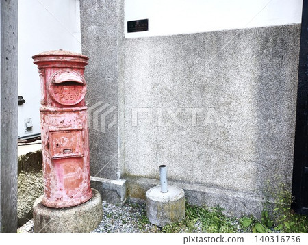 An old mailbox and a stone wall An old mailbox and a stone wall 140316756