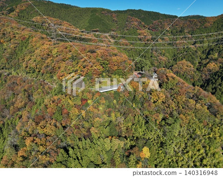 An aerial photograph overlooking the mountains and bridges in Sagamihara City, Kanagawa Prefecture, ablaze with autumn colors. An aerial photograph overlooking the mountains and bridges in Sagamihara City, Kanagawa Prefecture, ablaze with autumn colors. 140316948
