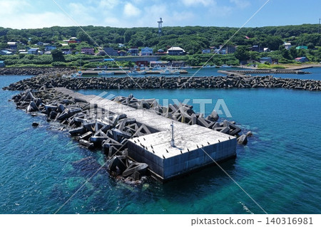 Aerial photograph capturing the breakwater and fishing port of Yagishiri Island, Hokkaido. 140316981