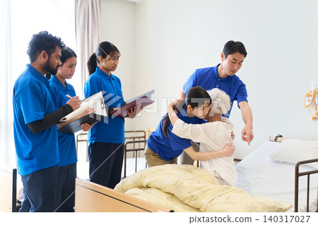 Asian caregivers providing caregiving instruction at nursing care facilities Asian caregivers providing caregiving instruction at nursing care facilities 140317027
