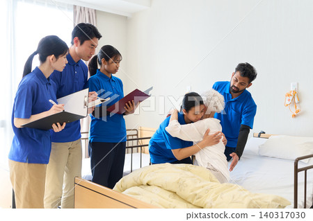 Southeast Asian caregivers providing caregiving instruction at nursing care facilities Southeast Asian caregivers providing caregiving instruction at nursing care facilities 140317030