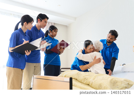 Southeast Asian caregivers providing caregiving instruction at nursing care facilities Southeast Asian caregivers providing caregiving instruction at nursing care facilities 140317031