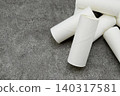 Toilet paper rolls placed haphazardly 140317581