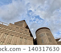 A building soaring against the blue sky 140317630