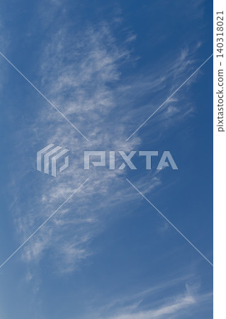 White cirrocumulus and cirrus fibratus clouds drifting in blue sky. White cirrocumulus and cirrus fibratus clouds drifting in blue sky. 140318021
