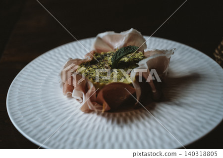 Tartlet with Avocado Cream and Quinoa in Prosciutto Flower Tartlet with Avocado Cream and Quinoa in Prosciutto Flower 140318805