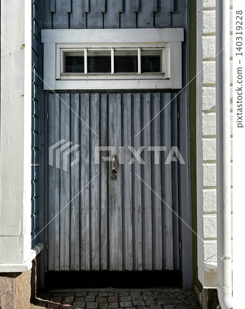 Timeworn Wooden Door of Entrance to Old House. Timeworn Wooden Door of Entrance to Old House. 140319228