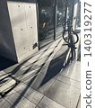 Long shadows stretching from the bicycle 140319277