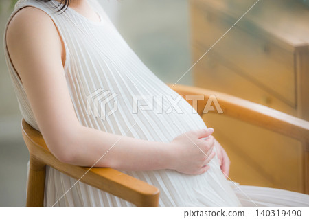 Pregnant woman relaxing in her room 140319490