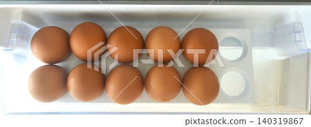 fresh brown egg raw food and ingredient arranging on tray in refrigerator door fresh brown egg raw food and ingredient arranging on tray in refrigerator door 140319867