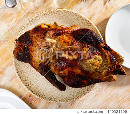 Homemade fried duck stuffed with pearl barley Homemade fried duck stuffed with pearl barley 140321506