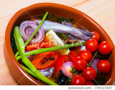 Fisherman's soup prepared with poutassou, small sea fish, cherry tomatoes Fisherman's soup prepared with poutassou, small sea fish, cherry tomatoes 140321687