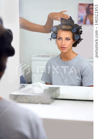 Beauty, hair curlers and woman in mirror of salon with .professional stylist for makeover. Haircare, face reflection or curling and celebrity or actress getting ready backstage behind the scenes Beauty, hair curlers and woman in mirror of salon with .professional stylist for makeover. Haircare, face reflection or curling and celebrity or actress getting ready backstage behind the scenes 140321953
