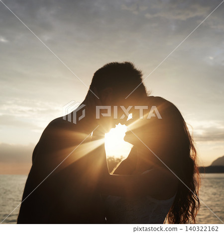 Silhouette, couple and face at ocean for sunset, vacation or travel together in summer on lens flare. Man, woman and romance at sea with shadow for connection, love and adventure by water outdoor Silhouette, couple and face at ocean for sunset, vacation or travel together in summer on lens flare. Man, woman and romance at sea with shadow for connection, love and adventure by water outdoor 140322162