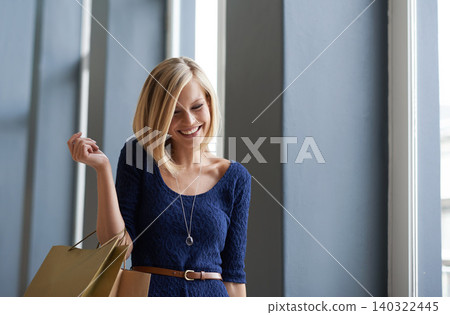 Happy, smile and woman with shopping bags in fashion mall, shop or boutique for gift. Excited, customer and young female person with style clothing at retail store for sale, discount or promotion. Happy, smile and woman with shopping bags in fashion mall, shop or boutique for gift. Excited, customer and young female person with style clothing at retail store for sale, discount or promotion. 140322445