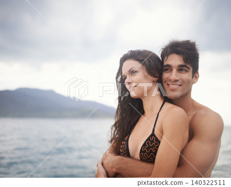 Couple, embrace and travel to ocean on holiday, love and relax by water on adventure. Happy people, peace and bonding for relationship in outdoors, support and hug on weekend trip to sea or nature Couple, embrace and travel to ocean on holiday, love and relax by water on adventure. Happy people, peace and bonding for relationship in outdoors, support and hug on weekend trip to sea or nature 140322511