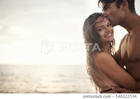 Portrait, happy couple and kiss at sea at sunset on vacation, holiday or travel together. Face, man and woman at ocean for adventure, romance or connection in summer by water for love on mockup space Portrait, happy couple and kiss at sea at sunset on vacation, holiday or travel together. Face, man and woman at ocean for adventure, romance or connection in summer by water for love on mockup space 140322534