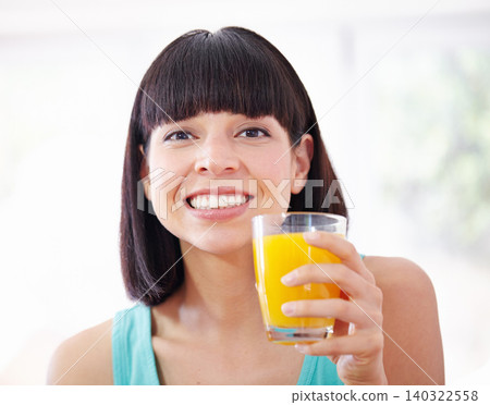 Portrait, orange juice and happy woman with drink for healthy diet, nutrition or wellness in home. Face, glass or person with beverage, vitamin c and organic fruit liquid for breakfast in the morning Portrait, orange juice and happy woman with drink for healthy diet, nutrition or wellness in home. Face, glass or person with beverage, vitamin c and organic fruit liquid for breakfast in the morning 140322558