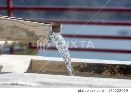 Close-up of the footbath spout and water droplets Close-up of the footbath spout and water droplets 140322619