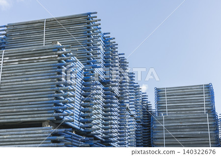 Stacked scaffolding pipes and the blue sky 140322676