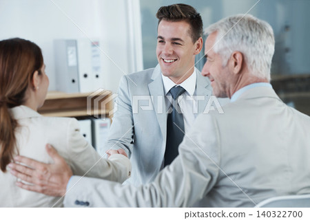 Happy, handshake and hr with candidate in office for business meeting, discussion or recruitment. Smile, hiring and man talking to professional human resources managers in workplace boardroom. Happy, handshake and hr with candidate in office for business meeting, discussion or recruitment. Smile, hiring and man talking to professional human resources managers in workplace boardroom. 140322700