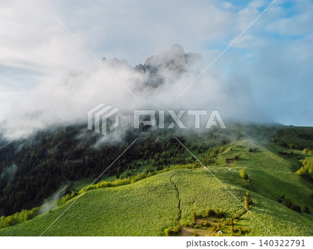 Scenic view of rock mount Bolshoy Tkhach with clouds in Caucasus mountains Scenic view of rock mount Bolshoy Tkhach with clouds in Caucasus mountains 140322791