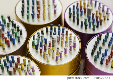 A round case filled with colorful dental posts and precision dental materials | Advertising material A round case filled with colorful dental posts and precision dental materials | Advertising material 140322854