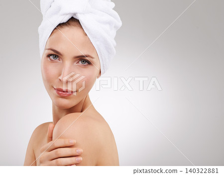 Beauty, skincare and portrait of woman with towel, natural glow and mockup space in studio. Dermatology, healthy skin and girl on white background with luxury facial, morning routine and cosmetics. 140322881