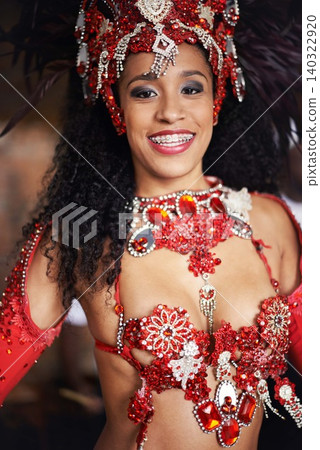 Dancer, carnival and girl in portrait with smile, pride or culture with glow for street performance in night. Person, fashion and woman at event, party or celebration with tradition in Rio de Janeiro Dancer, carnival and girl in portrait with smile, pride or culture with glow for street performance in night. Person, fashion and woman at event, party or celebration with tradition in Rio de Janeiro 140322920