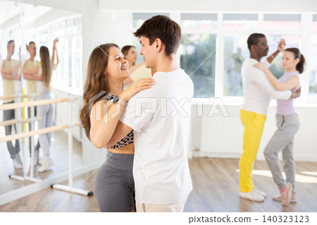 young woman and man dancing waltz 140323123