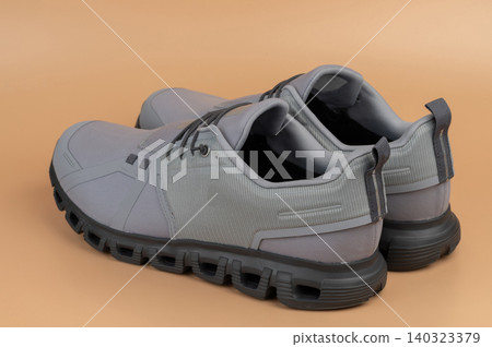 Gray pair of sport shoes Gray pair of sport shoes 140323379