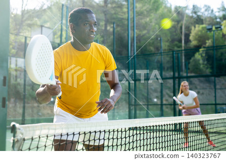 African american man playing padel tennis African american man playing padel tennis 140323767