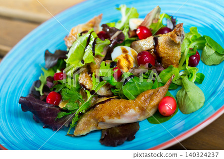Salad with quail, berries and sauce Salad with quail, berries and sauce 140324237
