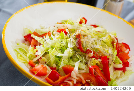Summer vegetable salad - red bell peppers, lettuce and onions Summer vegetable salad - red bell peppers, lettuce and onions 140324269