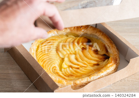 Homemade apple pie in a cardboard box. Homemade apple pie in a cardboard box. 140324284