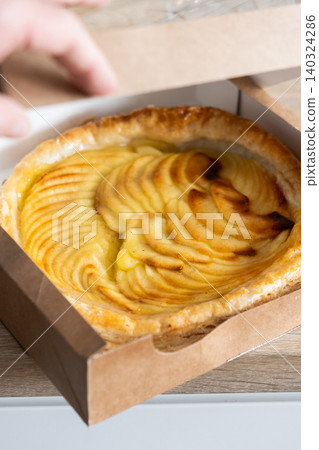 Homemade apple pie in a cardboard box. Homemade apple pie in a cardboard box. 140324286