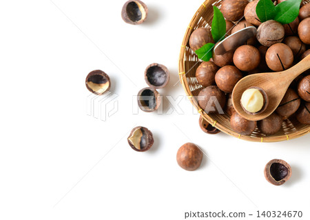 Top View of Macadamia Nuts in Basket with Kernel on Wooden Spoon and Copy Space Top View of Macadamia Nuts in Basket with Kernel on Wooden Spoon and Copy Space 140324670