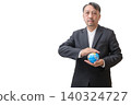 Businessman Holding Globe Symbolizing Global Business and Sustainability 140324727