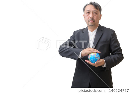 Businessman Holding Globe Symbolizing Global Business and Sustainability 140324727