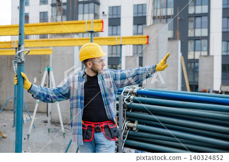 Construction worker wearing hard hat and safety glasses Construction worker wearing hard hat and safety glasses 140324852