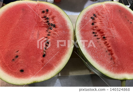 A summer tradition: a watermelon cut in half A summer tradition: a watermelon cut in half 140324868