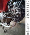 Close-Up Of Rusty Vintage Motorcycle Engine And Exhaust Showing Grime And Mechanical Detail 140325149