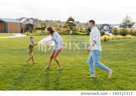 vacation, three, woman, man, child, game, day, summer, sunny, shorts, barefoot, shirt, house, camp vacation, three, woman, man, child, game, day, summer, sunny, shorts, barefoot, shirt, house, camp 140325317