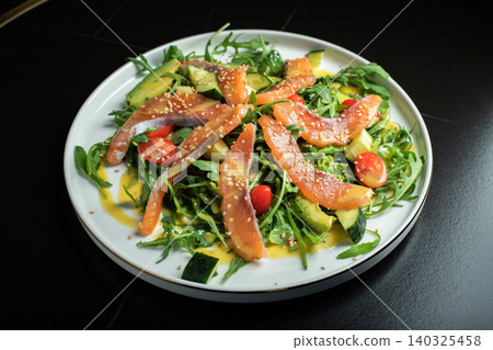 Salad with salted salmon and arugula Salad with salted salmon and arugula 140325458