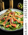 Salad with salted salmon and arugula 140325459