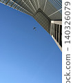 A passenger plane flying blue sky 140326079