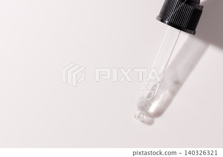 Liquid cosmetic product for the skin or medicine in a pipette. Copy space Liquid cosmetic product for the skin or medicine in a pipette. Copy space 140326321