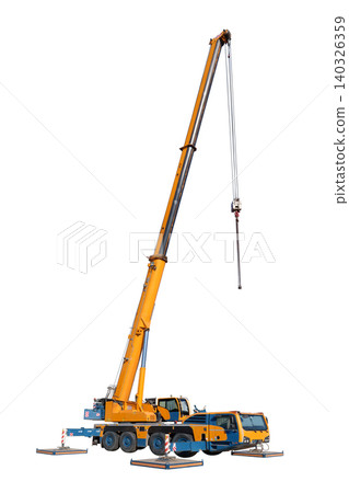 Vertical view, isolated full-size image of a truck crane with its boom extended and hook hanging down, and with the stops on the sides of the machine extended, on a white background Vertical view, isolated full-size image of a truck crane with its boom extended and hook hanging down, and with the stops on the sides of the machine extended, on a white background 140326359