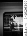 Abstract Silhouette on Train Reflected in Monochrome Architecture 140326399